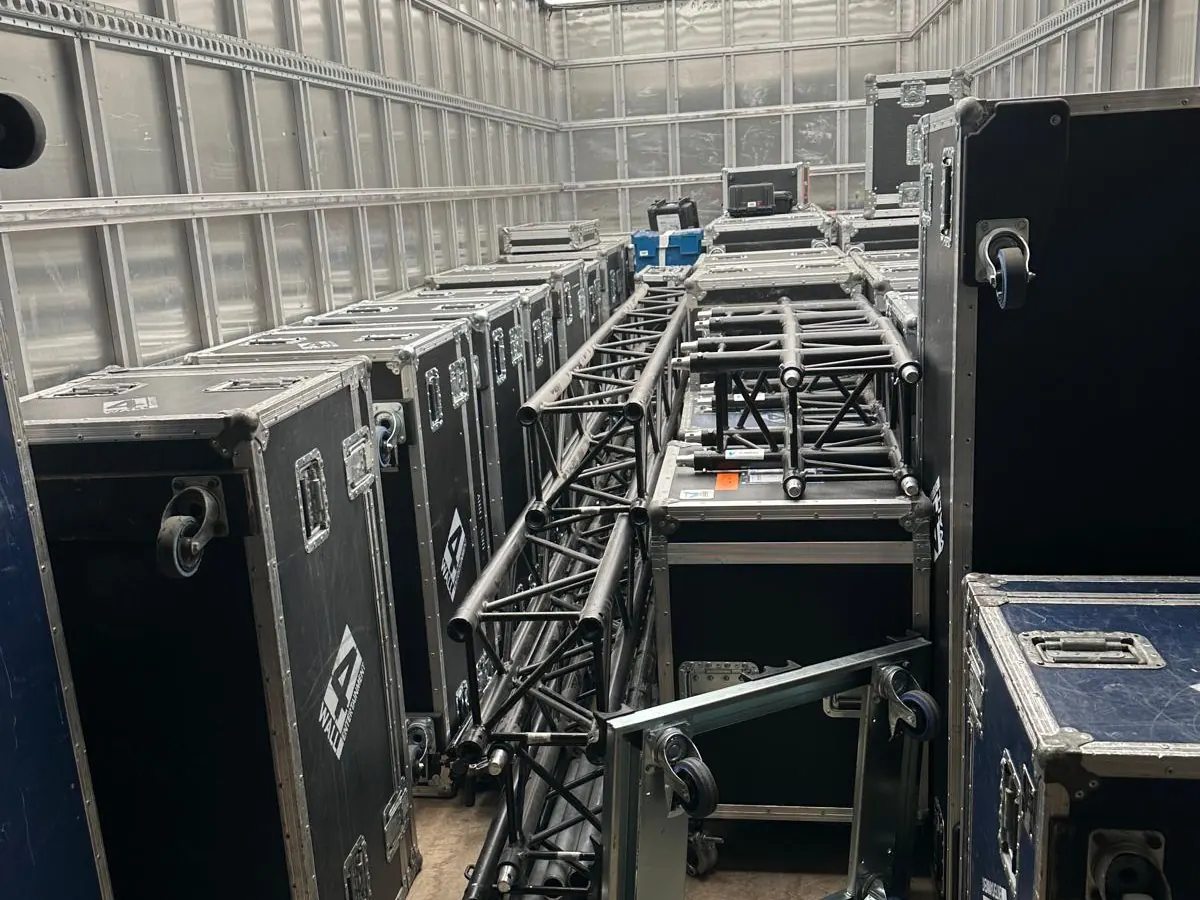 Aviv Removals trailer loaded with flight cases and staging equipment for event logistics