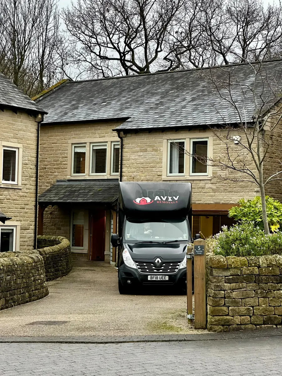Aviv Removals van in the driveway of a period home during a London house removal